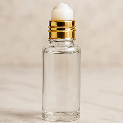 Clear glass perfume bottle with gold rollerball cap for Impression of Wind Flowers fragrance